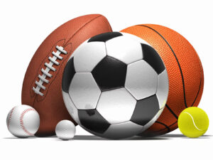 A collection of sports equipment: soccer balls, basketballs, footballs.