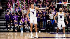 Two Northwestern basketball players are on the court in Welsh Ryan Arena.