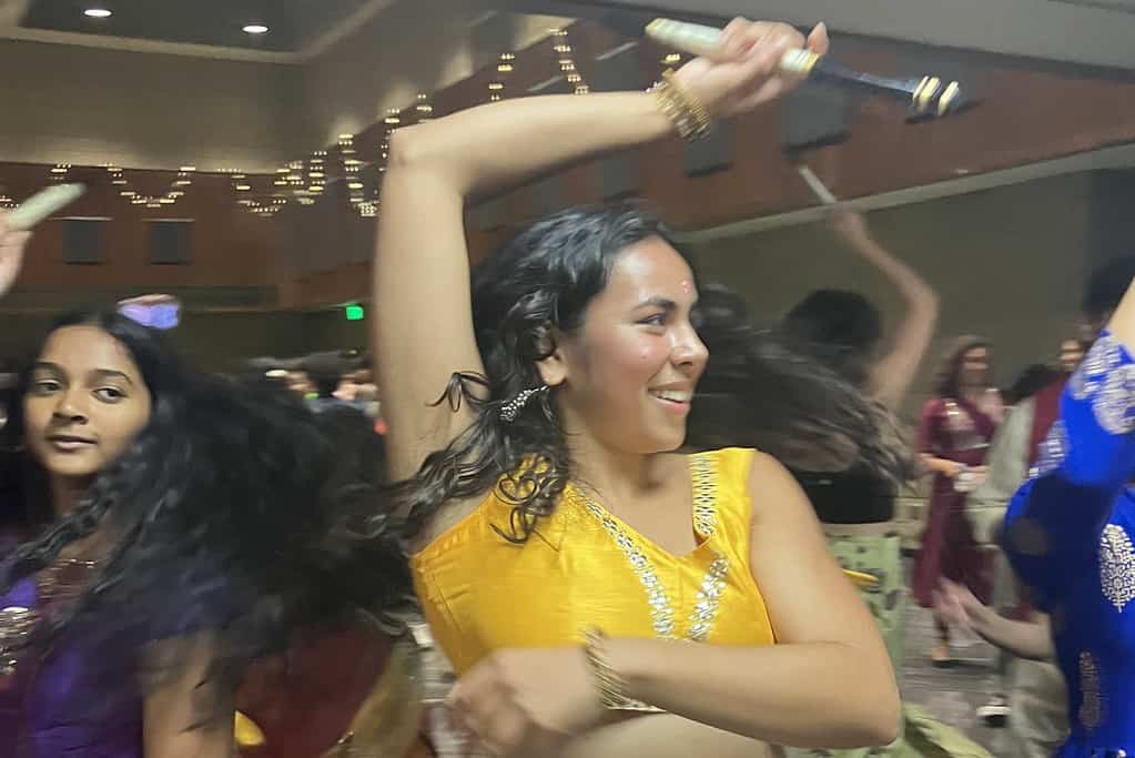 Northwestern students dance with Dandiya sticks, part of a Raas dance representing a battle.