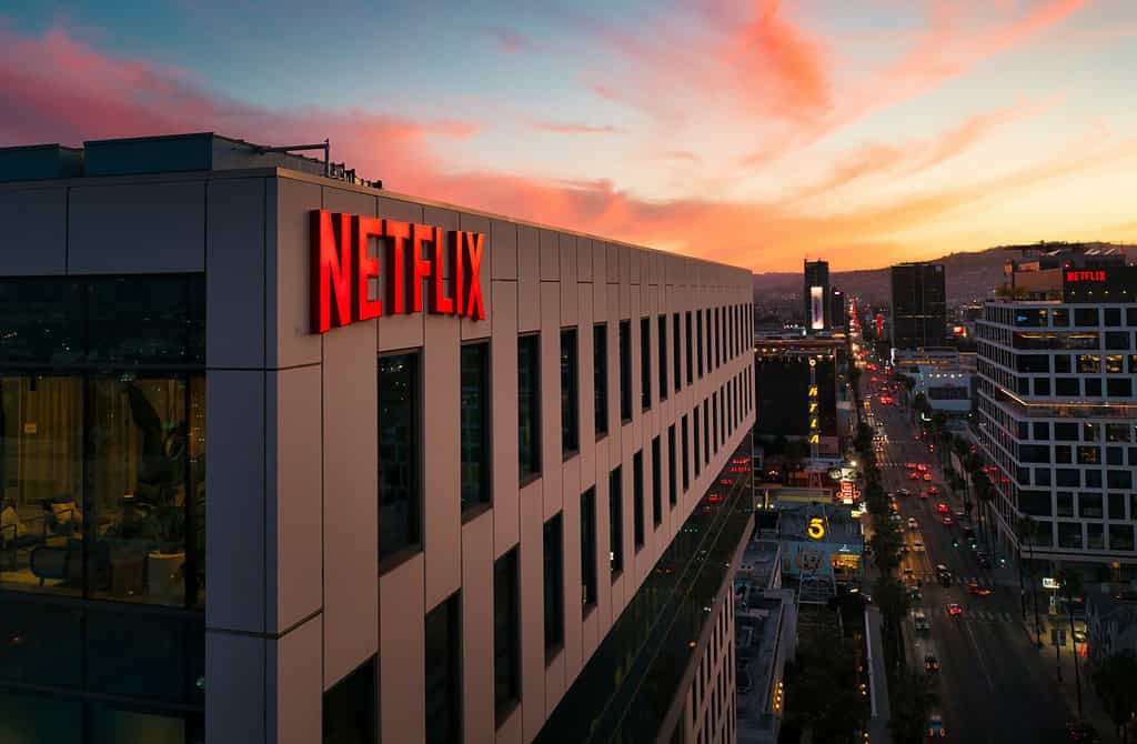 A diagonal view of a building with the word "Netflix" in red on the side